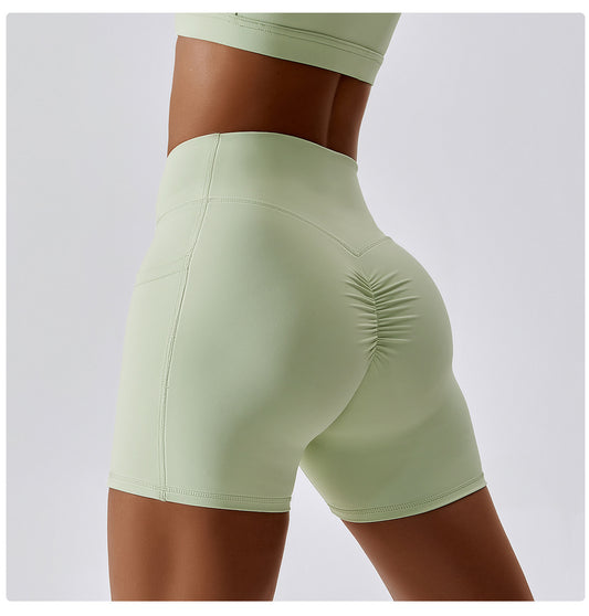 Solid color crossover waist pocket sports shorts