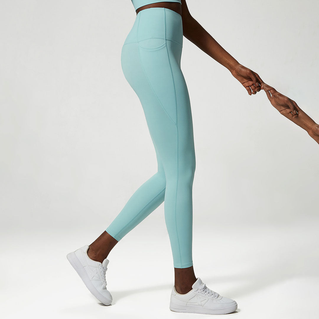 Legging de sport avec poches latérales de couleur unie