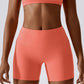 Solid color high-waisted sports shorts