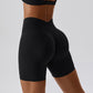 Short de sport taille haute rehaussant les hanches