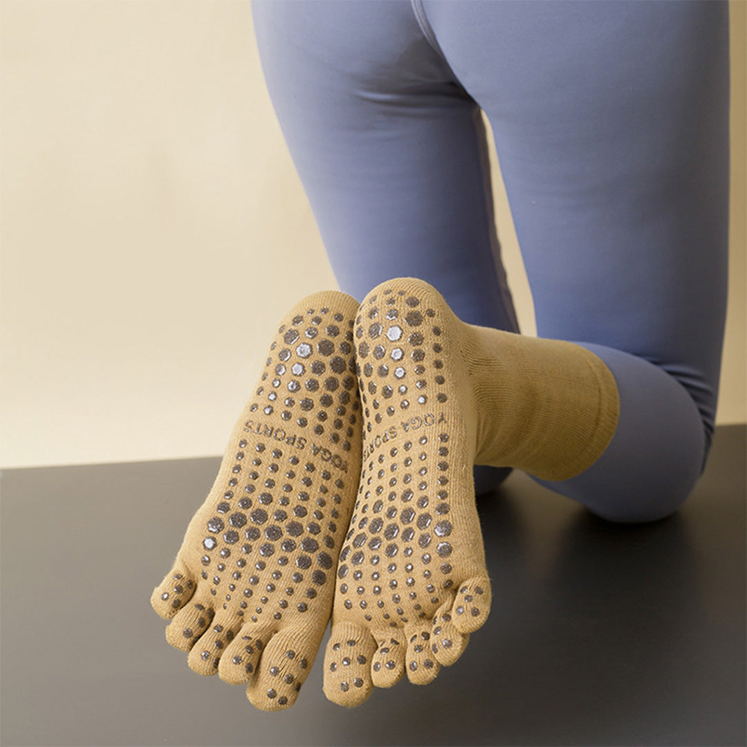 Chaussettes antidérapantes de yoga de sports de Pilates de mi-mollet