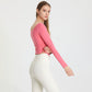 Side-pleated long-sleeved cropped sports top