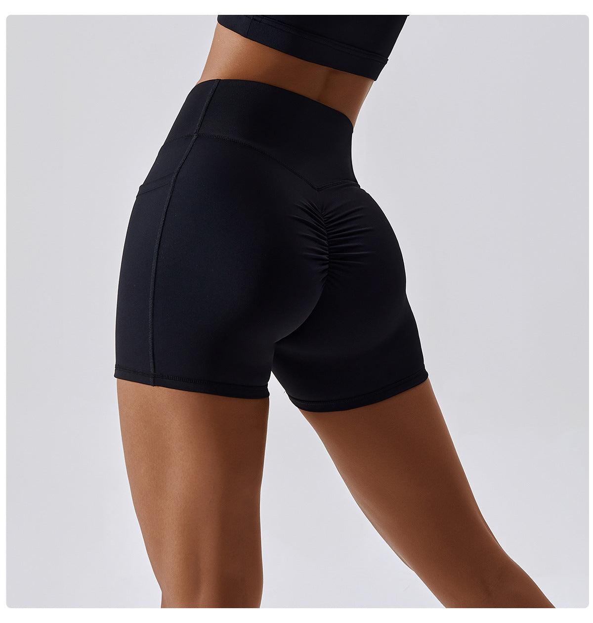 Solid color crossover waist pocket sports shorts