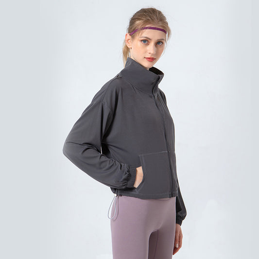 Stand collar elasticated hem zip pockets long-sleeved jacket