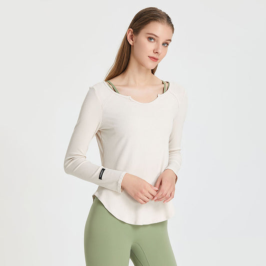 Solid color bottom irregular long sleeve sports top